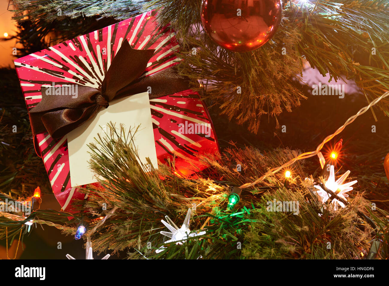 christmas present for kid on christmas  tree with lights and toys Stock Photo