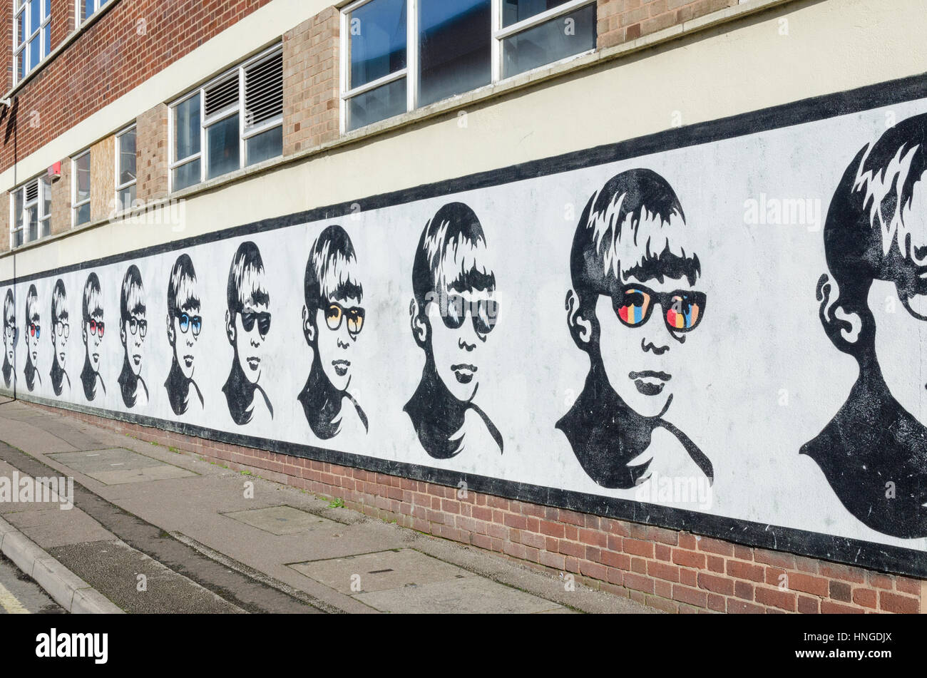 Boy with Glasses mural in Lower Essex Street, Birmingham painted by the street artist Golden Boy Stock Photo
