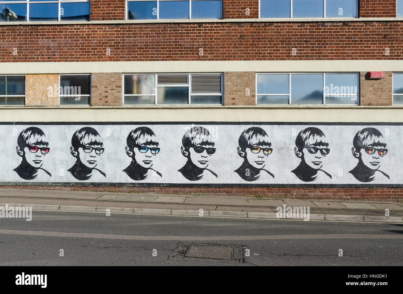 Boy with Glasses mural in Lower Essex Street, Birmingham painted by the street artist Golden Boy Stock Photo