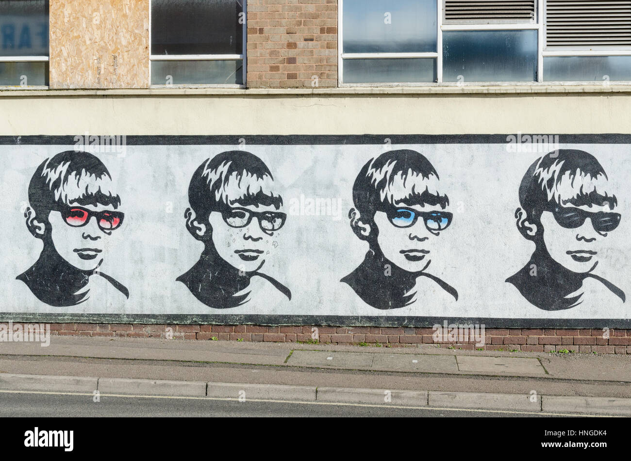 Boy with Glasses mural in Lower Essex Street, Birmingham painted by the street artist Golden Boy Stock Photo