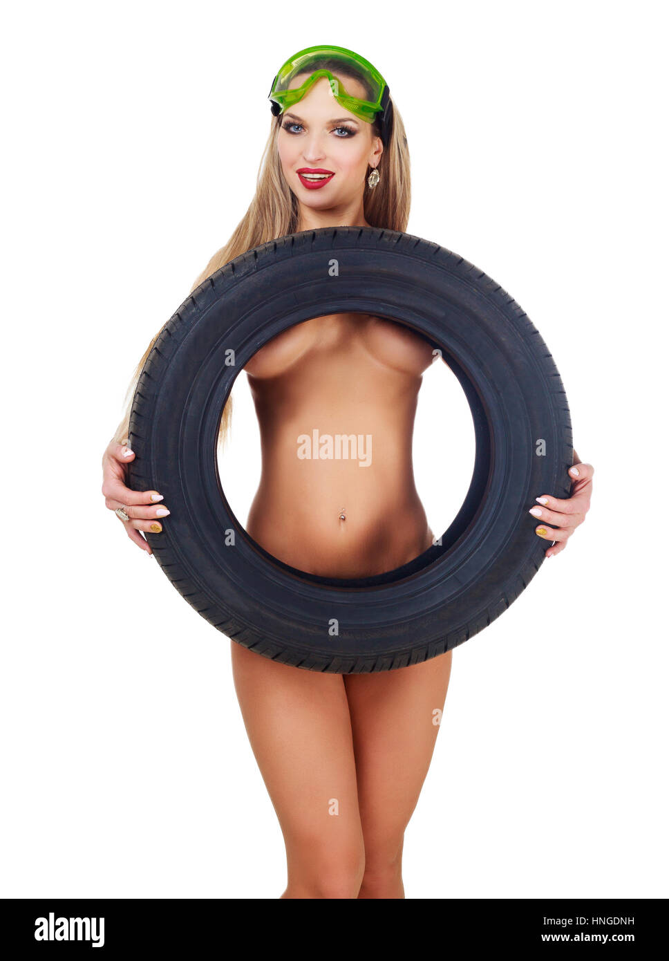 beautiful nude woman car mechanic with a tire, isolated against white  background Stock Photo - Alamy
