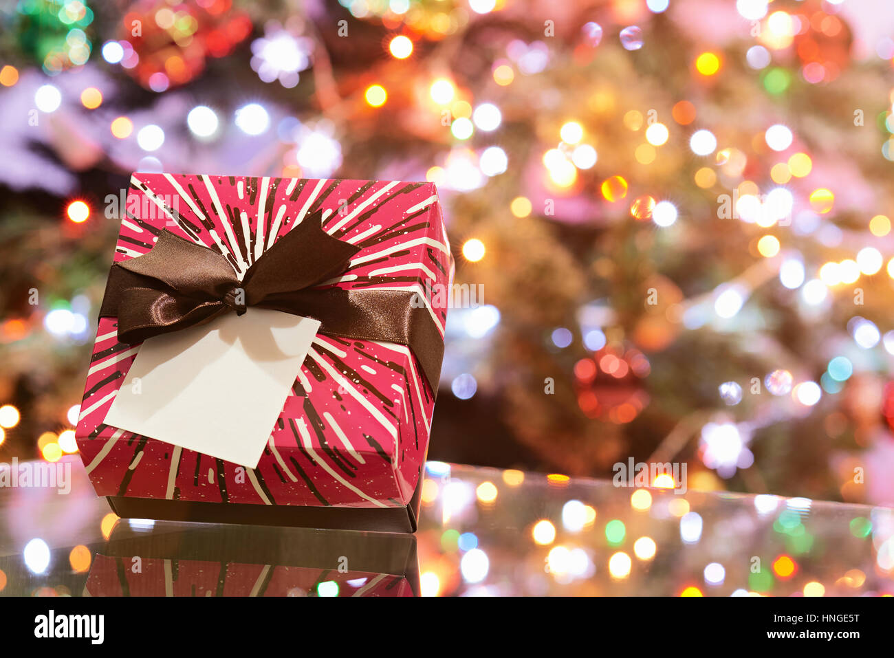 One pretty gift box for christmas celebration on christmas tree ...