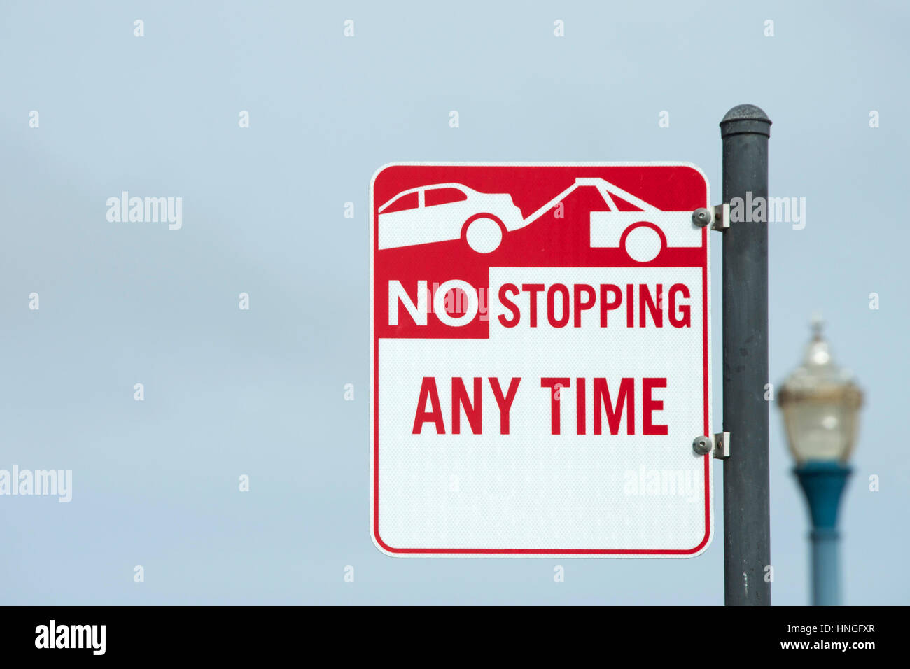 No Stopping Any Time Sign with image of car being towed away Stock ...