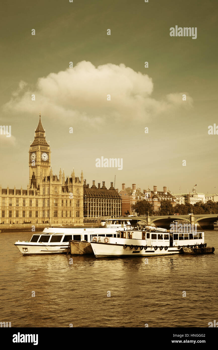 Big Ben and House of Parliament in London with boat in Thames River. Stock Photo