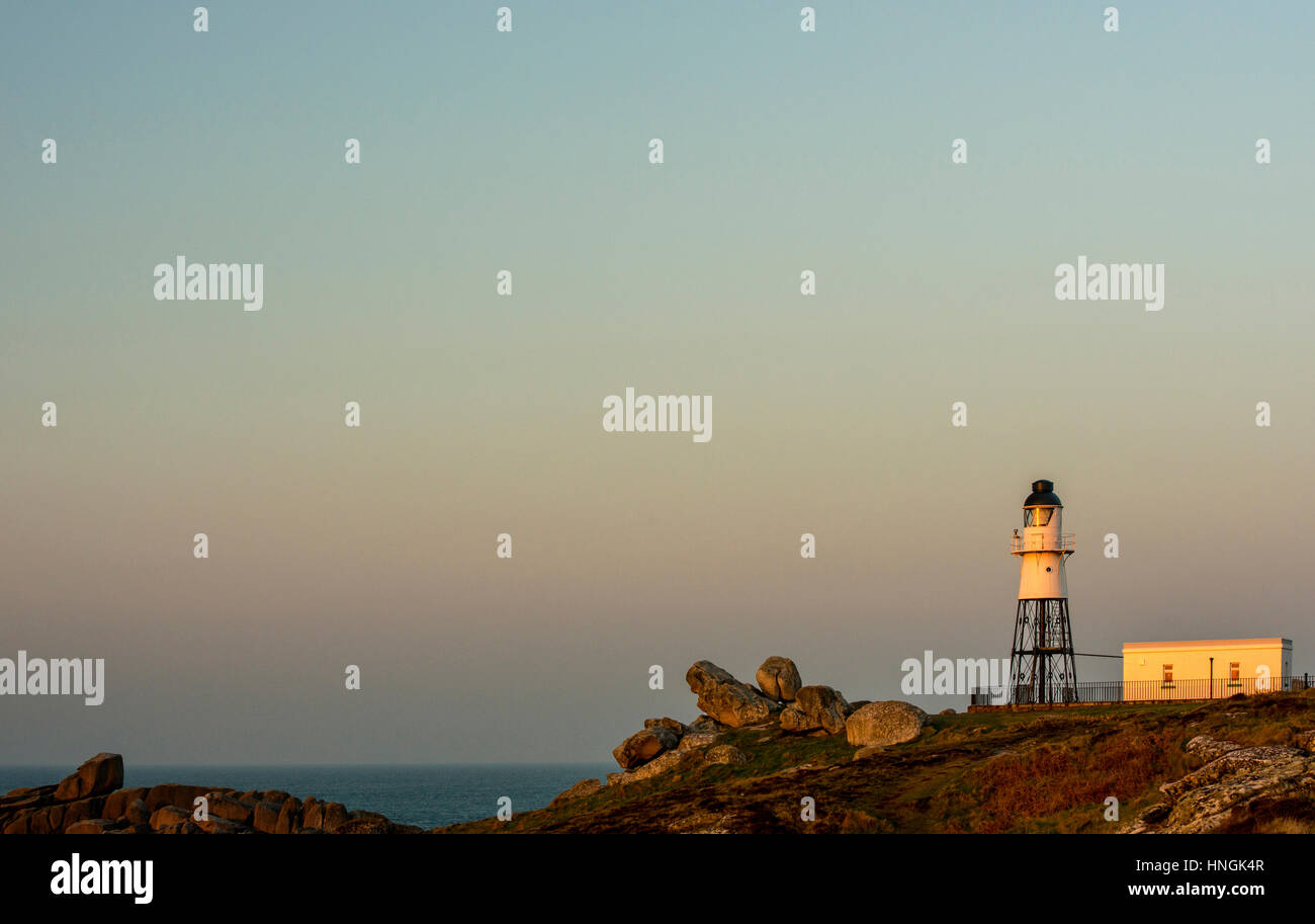 Peninnis Headland and Lighthouse St. Mary's Scillies at dawn Stock Photo