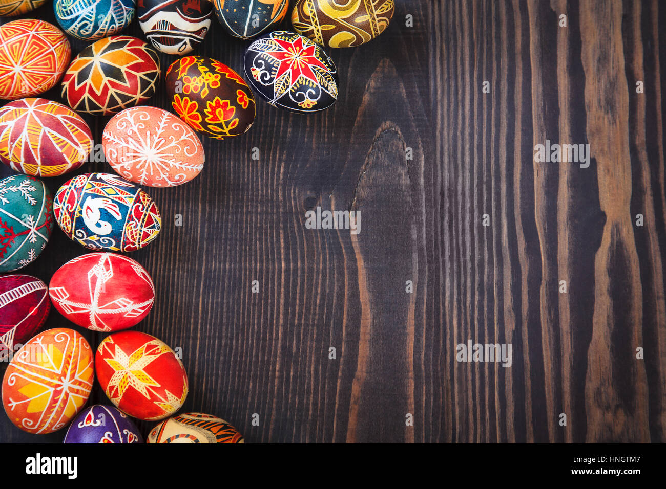 Easter eggs on a dark wooden background Stock Photo - Alamy