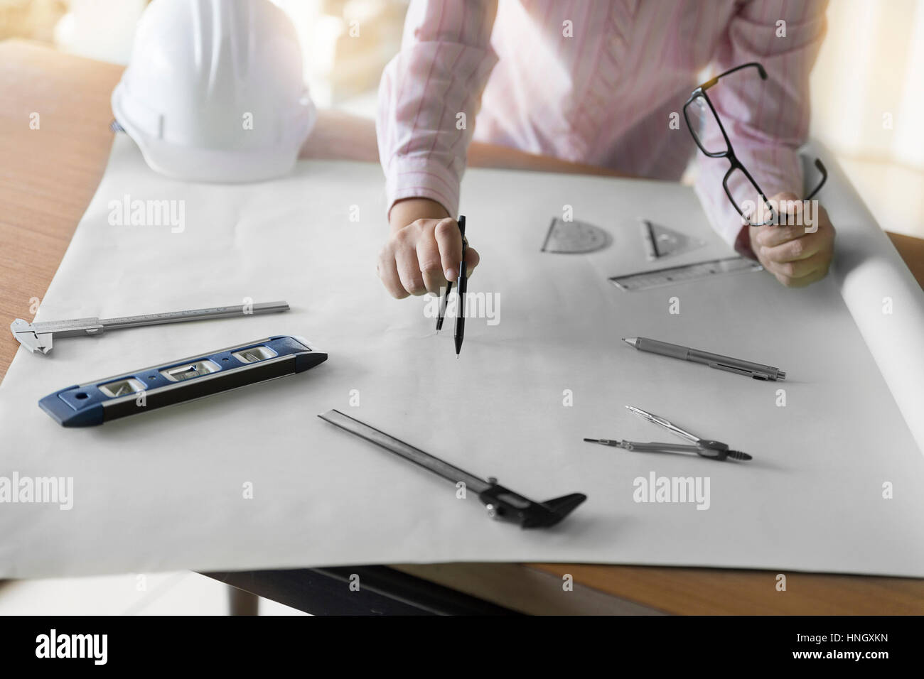 architect hand holding compass working on construction engineering ...