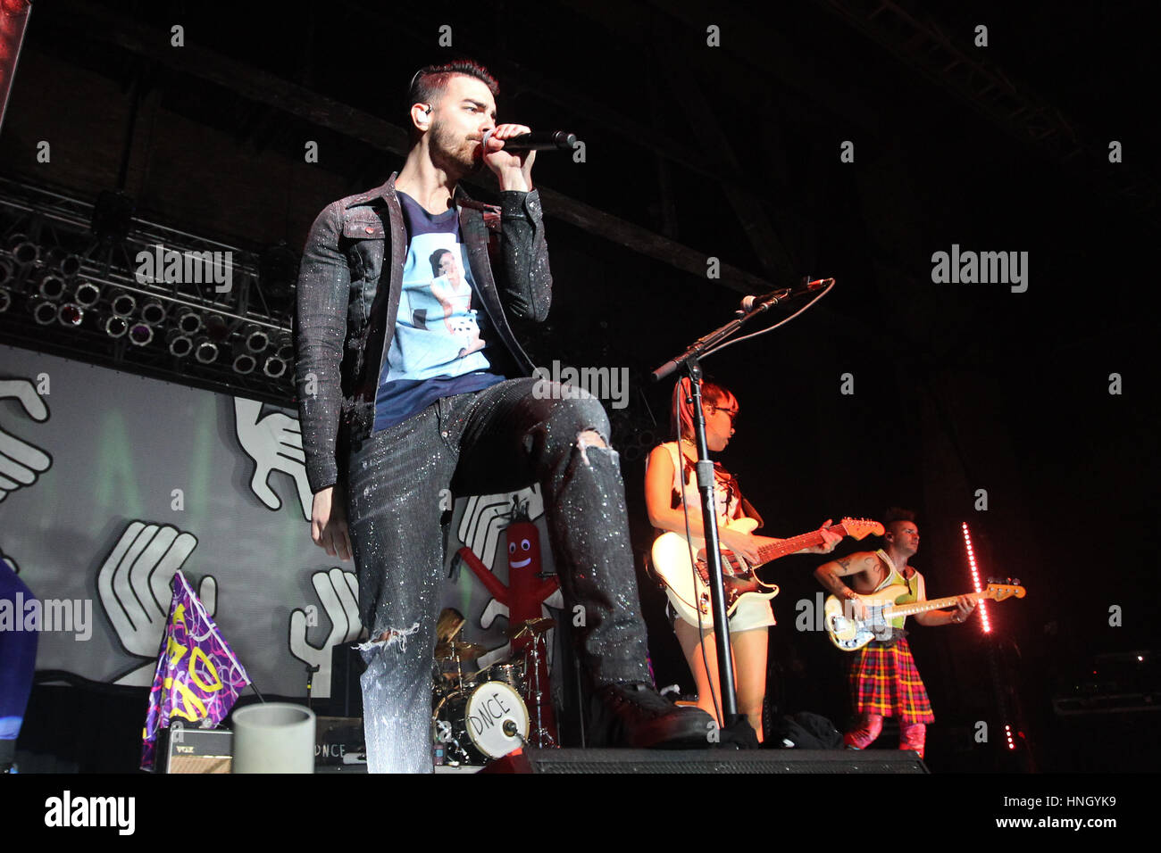 HUNTINGTON, NY-FEB 8: (L-R) Joe Jonas, JinJoo Lee and Cole Whittle of DNCE perform onstage at the Paramount on February 8, 2017 in Huntington, New Yor Stock Photo