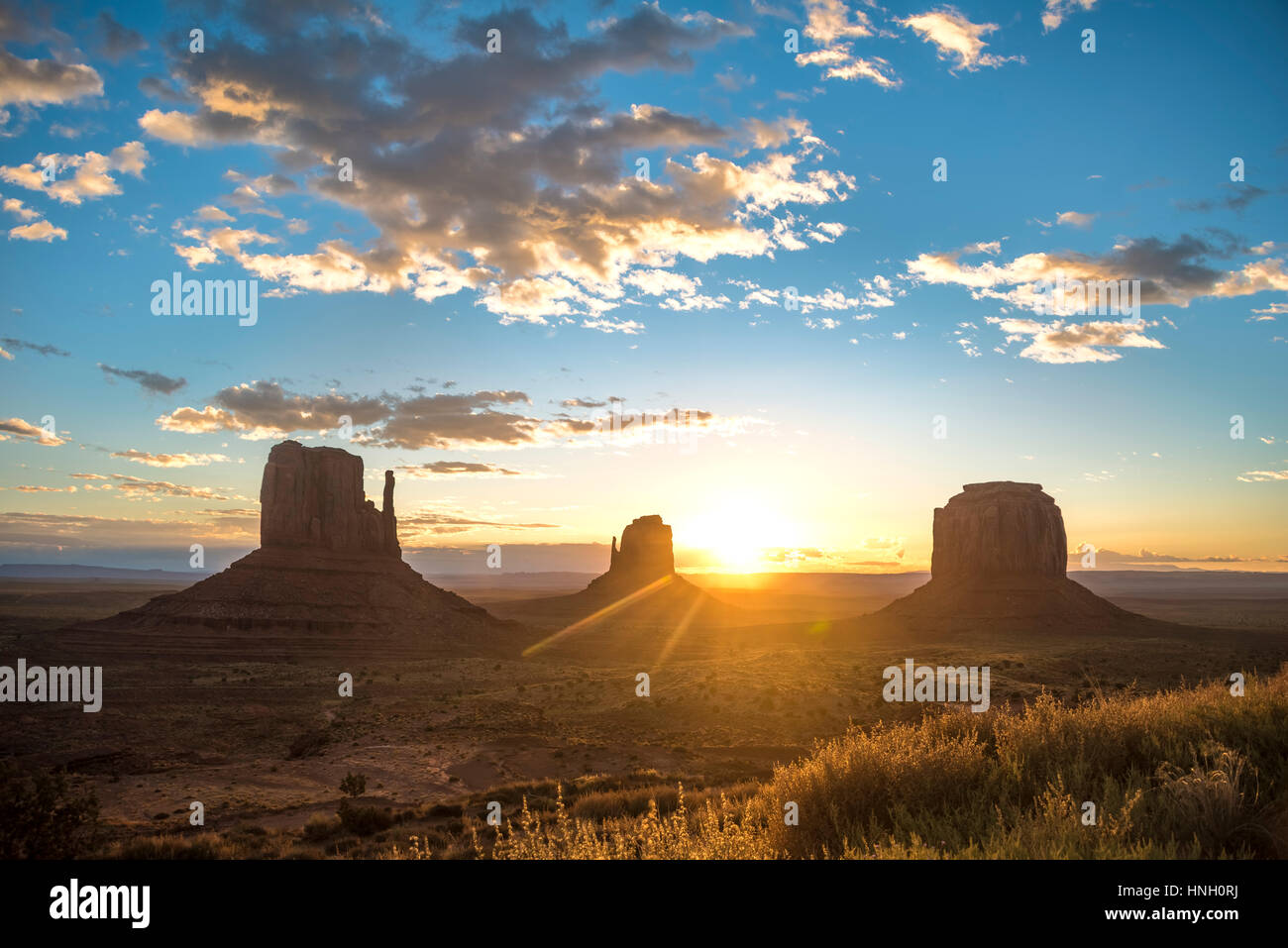 Sunrise, mesas West Mitten Butte, East Mitten Butte, Merrick Butte, Scenic Drive, Monument Valley, Monument Valley Navajo Tribal Stock Photo