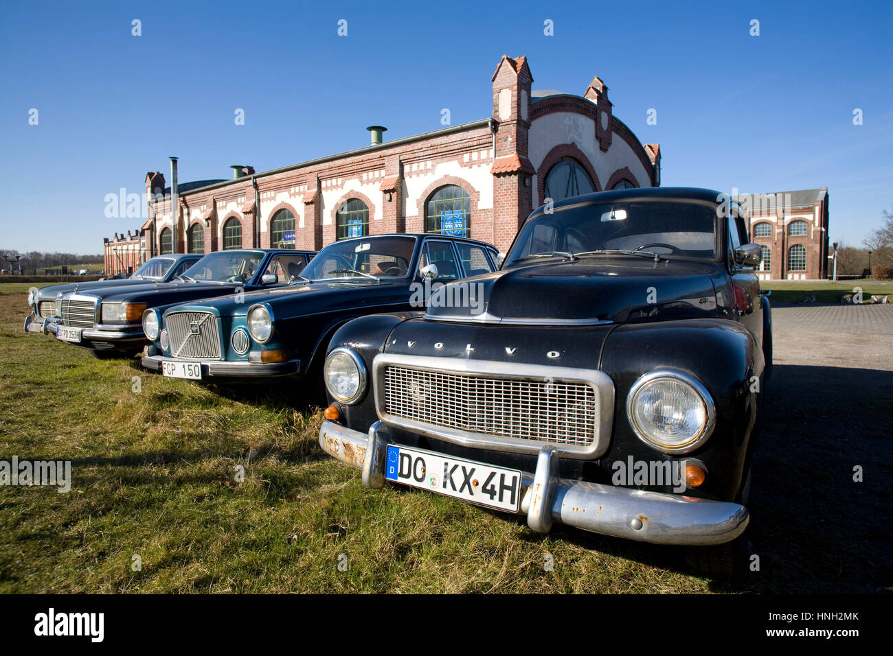 Germany, Waltrop, old Volvo PV 544 car in front of a building of the former coal-mine Waltrop Stock Photo