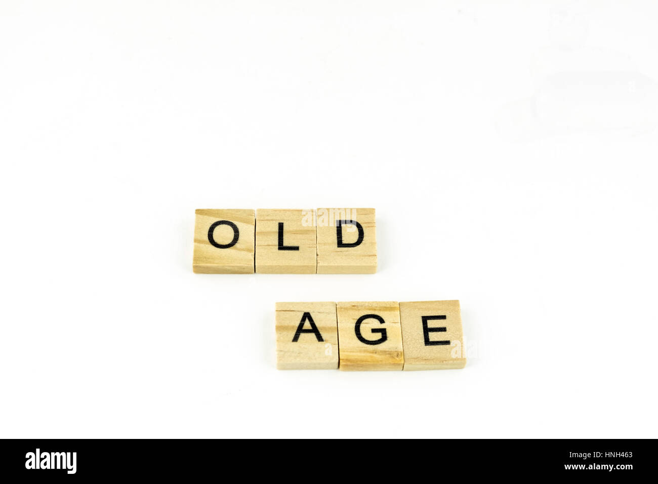 Wood blocks spelling Old Age on a white background. Cutout. Concept, Conceptual. Stock Photo