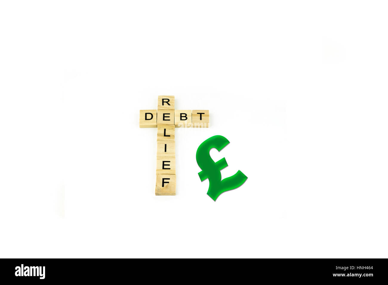 Concept Debt Free spelled out in wood blocks, cutout, white background. Stock Photo