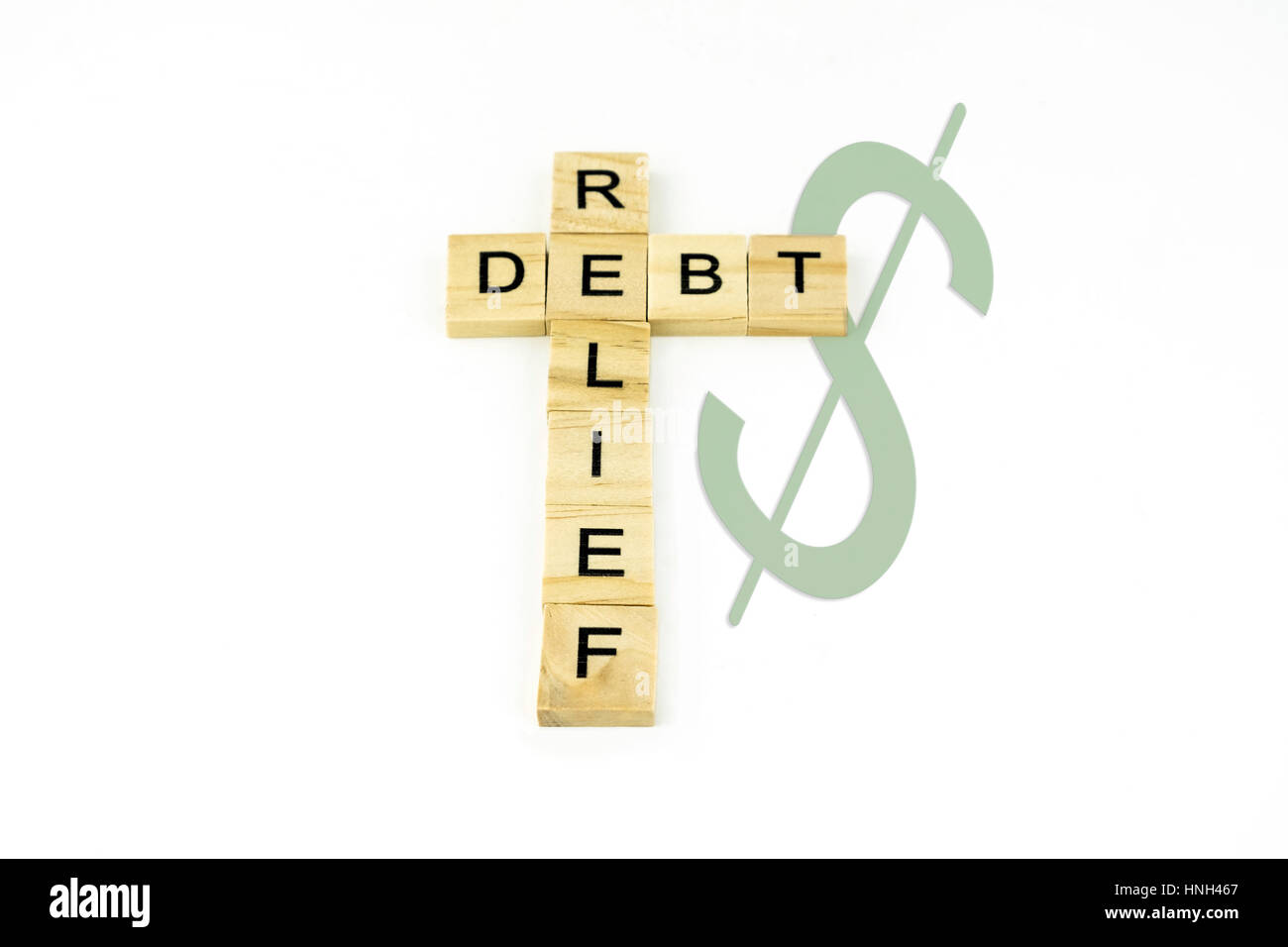Concept debt reflief spelled out in wood blocks. Stock Photo