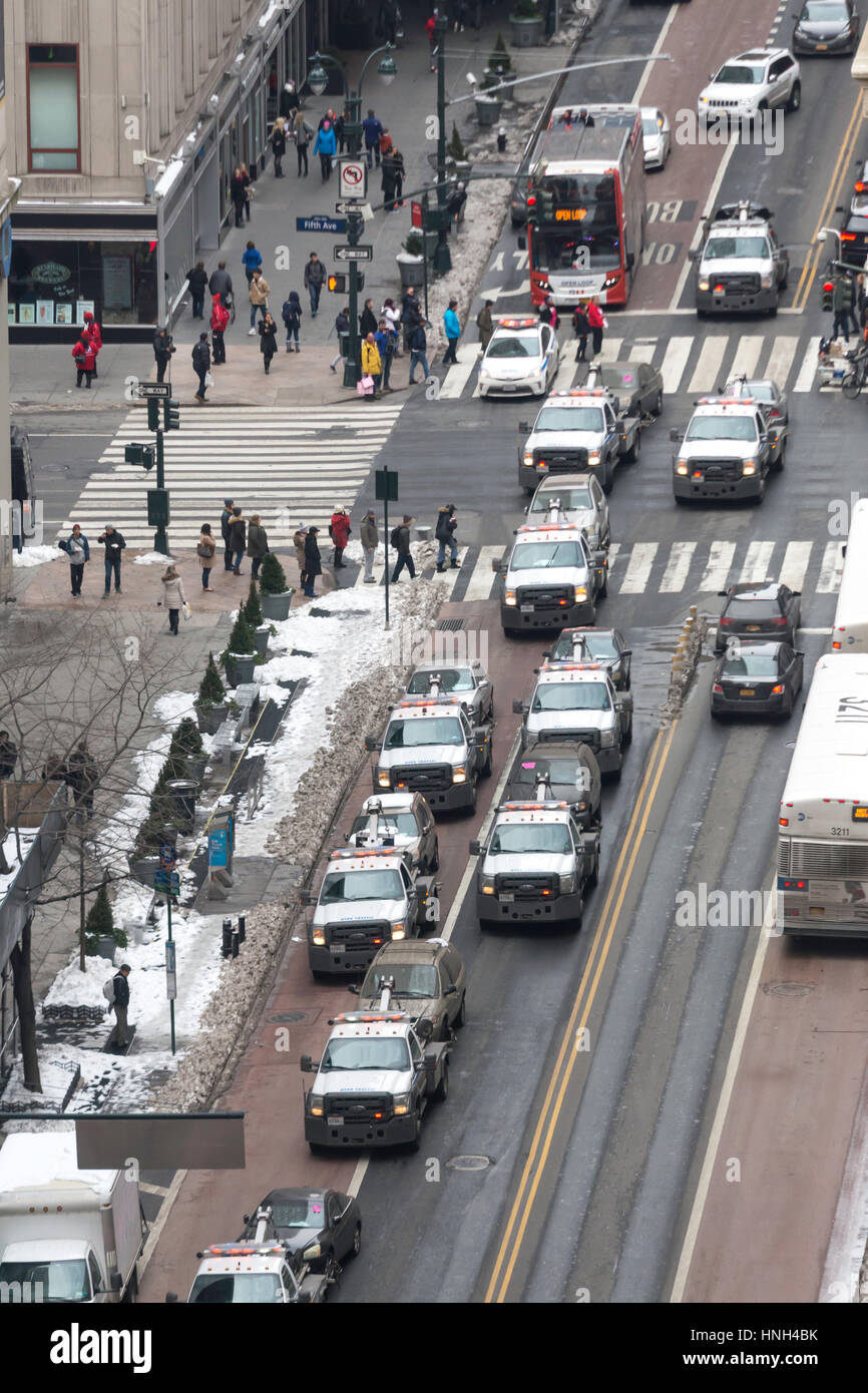 Large Group of City Tow Trucks with Cars in Tow, NYC, USA Stock Photo