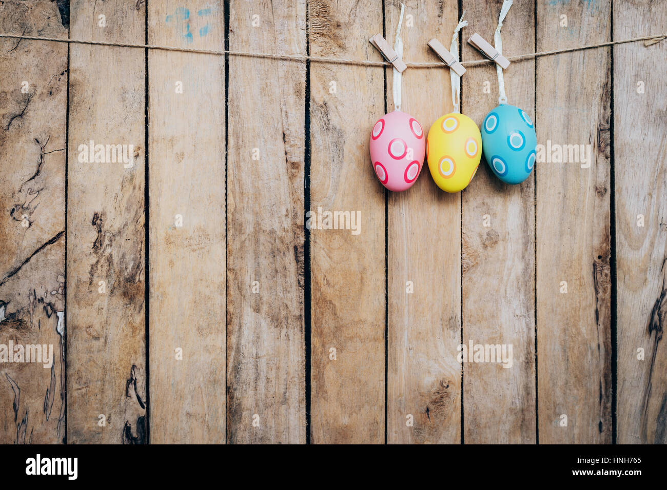 egg easter hanging on wood background with space Stock Photo