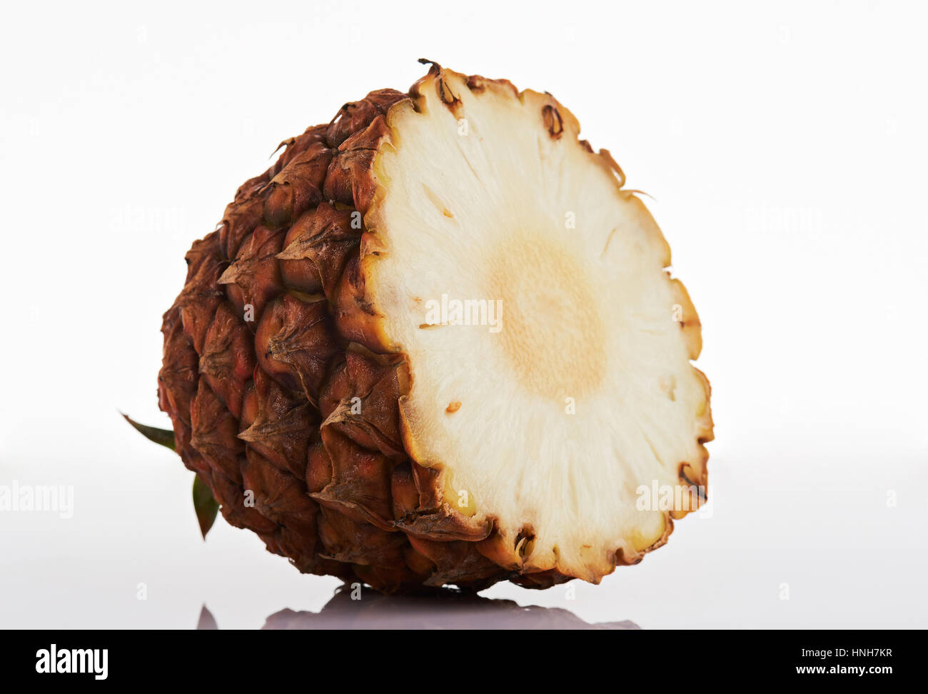 Half of pineapple fruit isolated on white background Stock Photo - Alamy