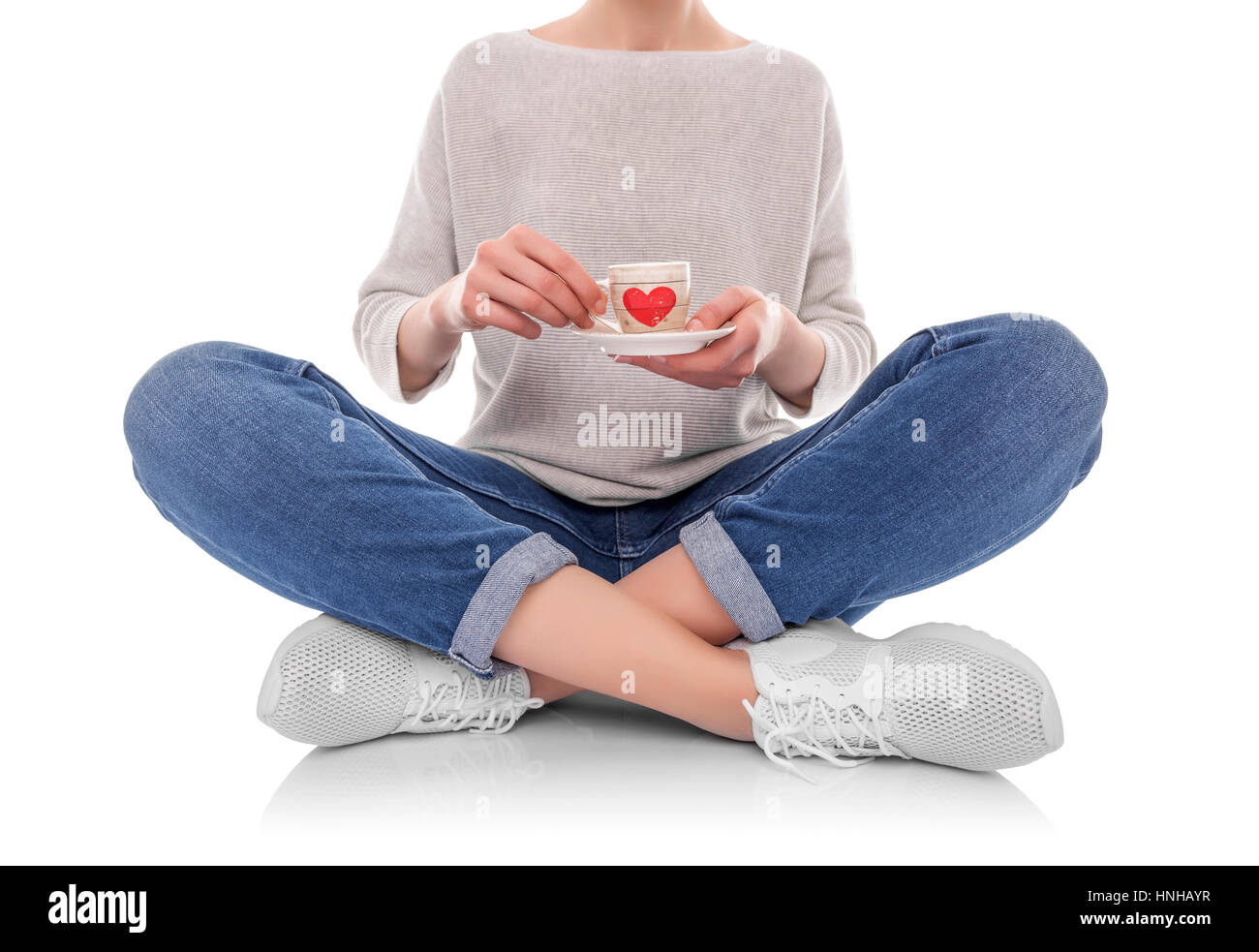 Woman holding a cup of coffee. Isolated on white background Stock Photo ...