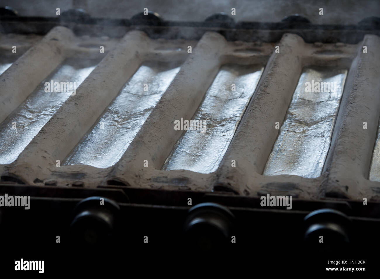 Stack of raw aluminum ingots in aluminum profiles factory, France Stock Photo