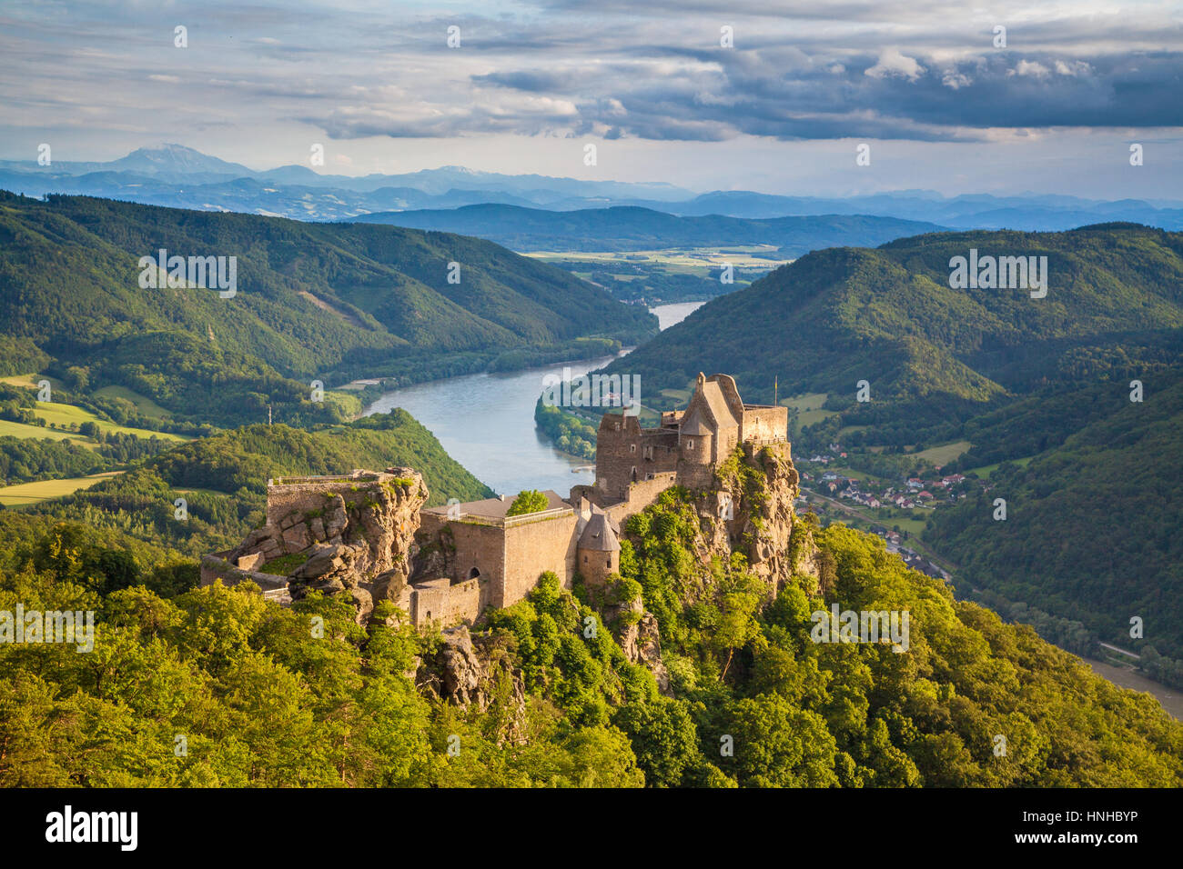 Classic aerial view of historic Aggstein castle ruin with famous Danube river in the background in beautiful sunset light, Wachau Valley, Austria Stock Photo