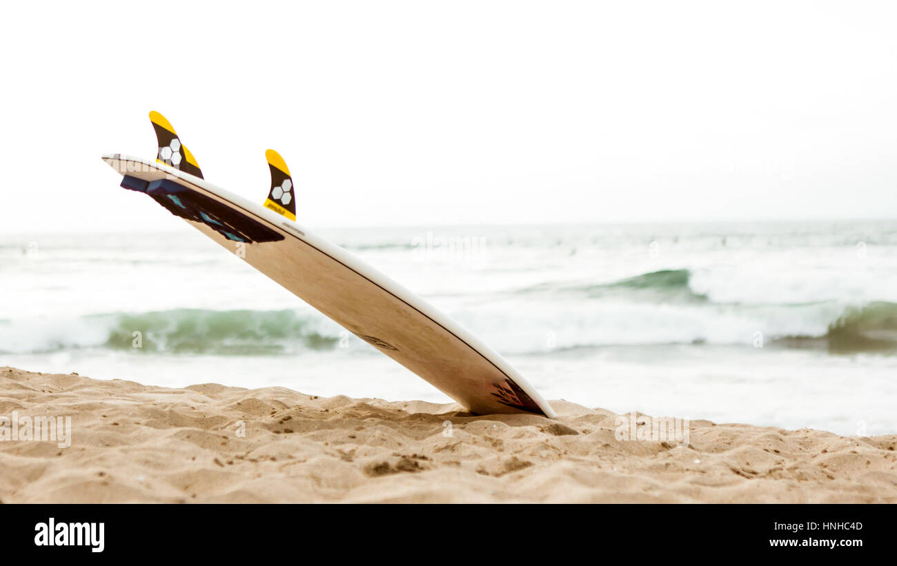A beach and a surf board Stock Photo