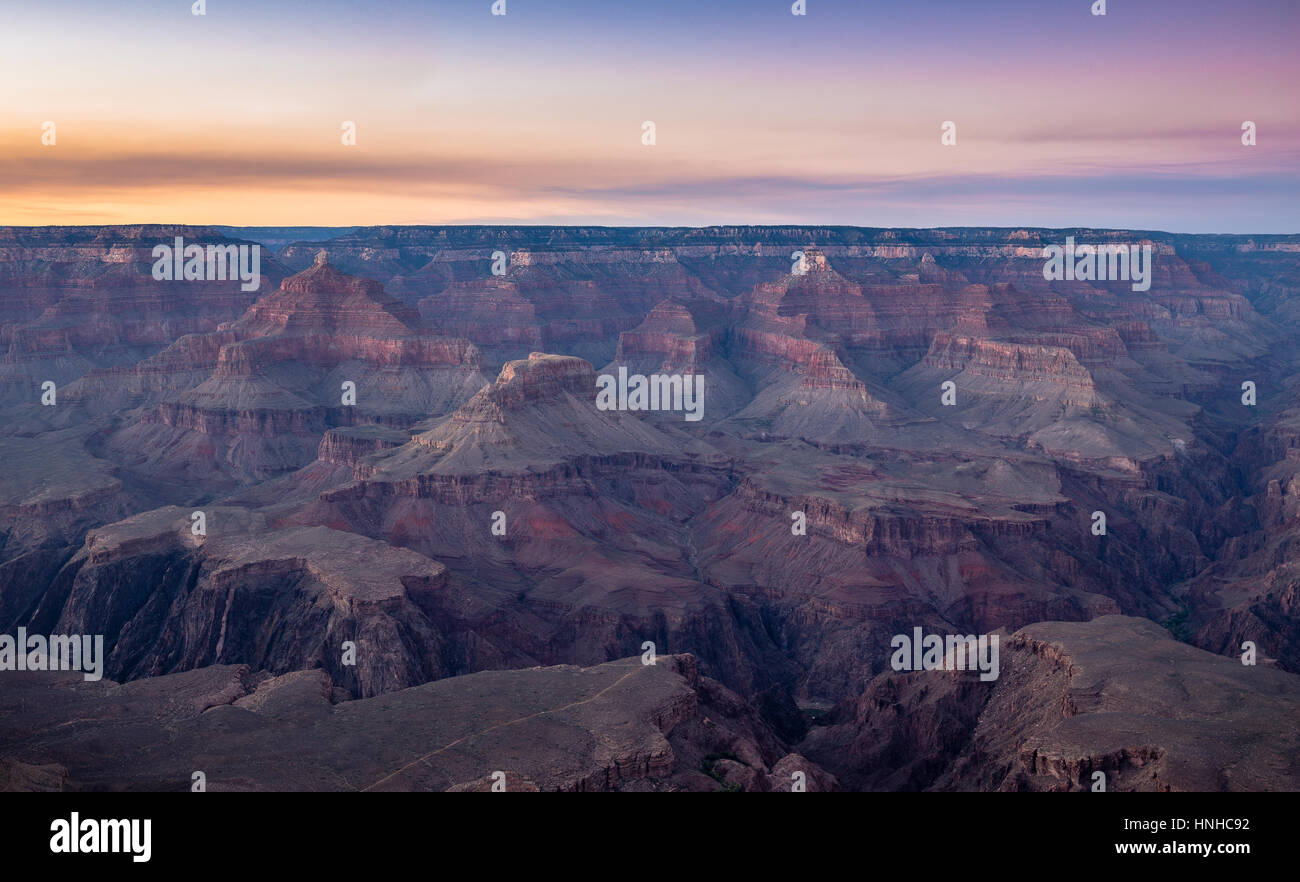 Scenic aerial view of famous Grand Canyon, often considered one of the Seven Natural Wonders of the World, in beautiful post sunset twilight at dusk Stock Photo