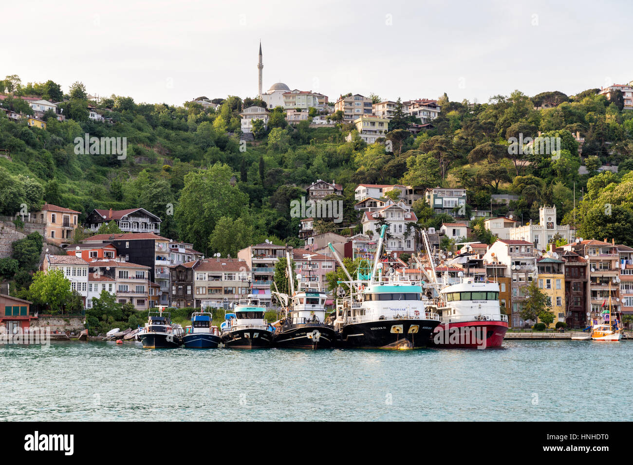 Fishing boats lined up on the Rumeli Kavagi shore. Rumeli Kavagi, a little fishing village on the northern of Bosphor Stock Photo