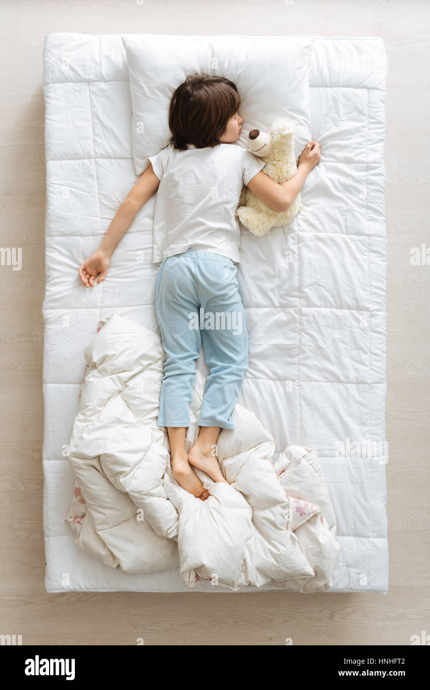 Tired young boy having a nap Stock Photo Alamy