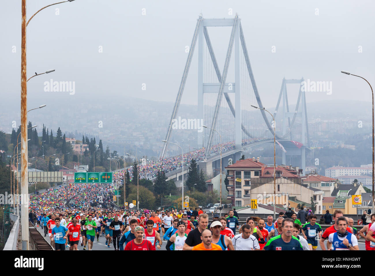 ISTANBUL, TURKEY - NOVEMBER 16: Competitors cross the Bosphorus Bridge that links Istanbul's European and Asian side during the 34th annual Euroasia Marathon on November 16, 2014 in Istanbul, Turkey. Stock Photo