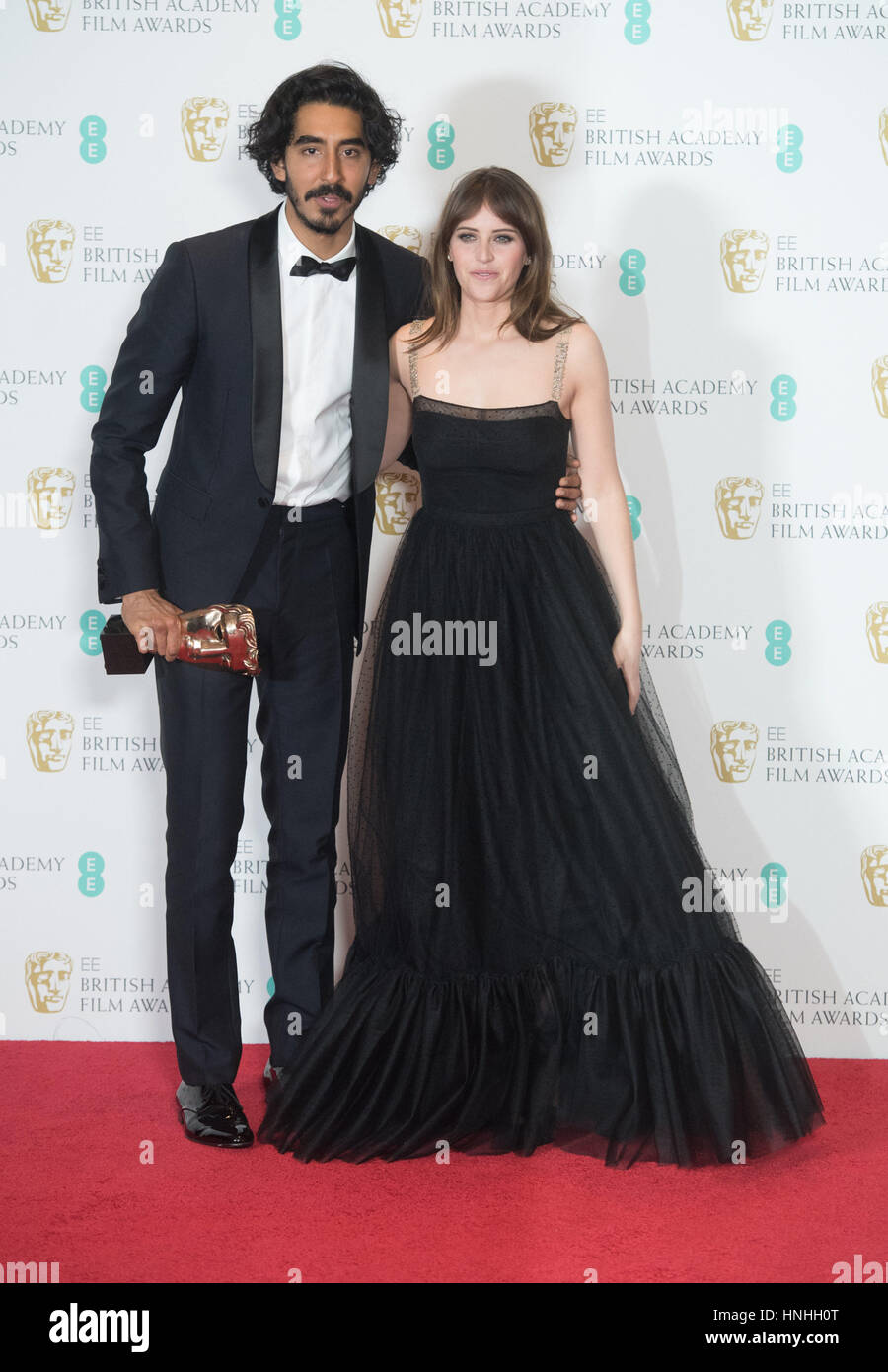 London, UK. 12th Feb, 2017. Actors Dev Patel and Felicity Jones pose in ...