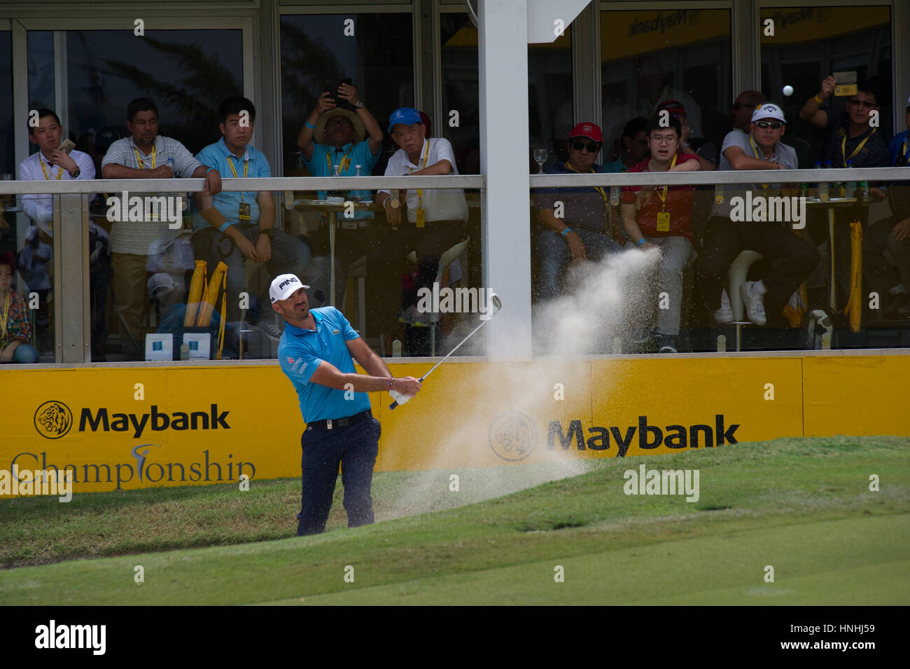 Kuala Lumpur, Malaysia. 12th Feb, 2017 Maybank Golf Championship, European Tour, Havret chips out of the bunker at 18 during the final round at the Maybank Championship at the Saujana Golf & Country Club, Kuala Lumpur, Malaysia. Credit: Flashspix/Alamy Live News Stock Photo