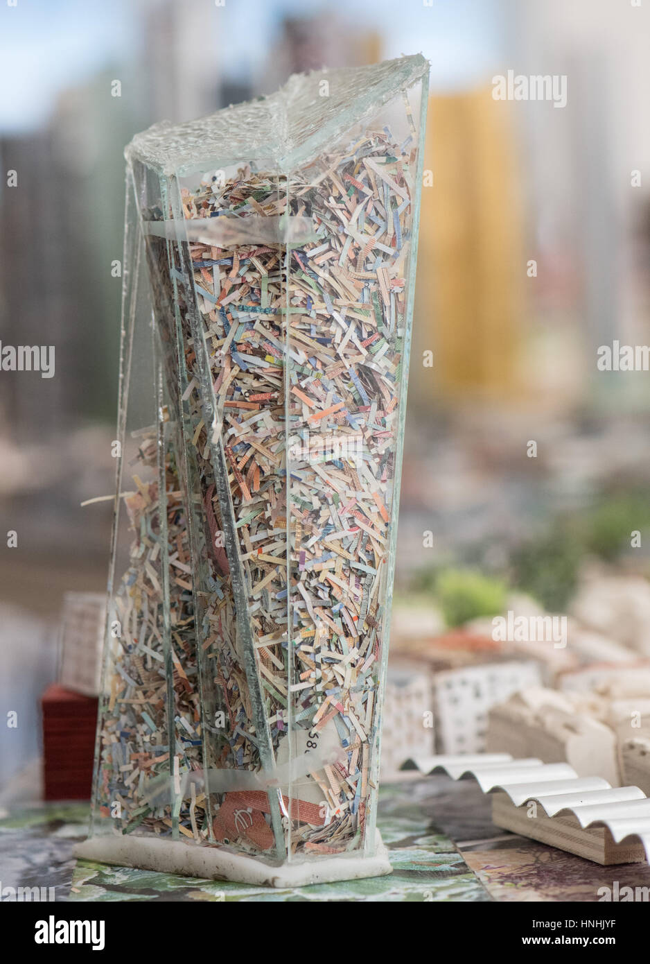 Frankfurt, Germany. 13th Feb, 2017. The plexi glas reconstruction of the European Central Bank is filled with shredded bank notes in the new model of the city of Frankfurt, Germany, 13 February 2017. The skyline of the other banking highrises can be seen in the background. The 70 squaremetres large model of the Dutch artist Hermann Helle can be viewed in the Museum of History starting in October in Frankfurt. Photo: Boris Roessler/dpa/Alamy Live News Stock Photo