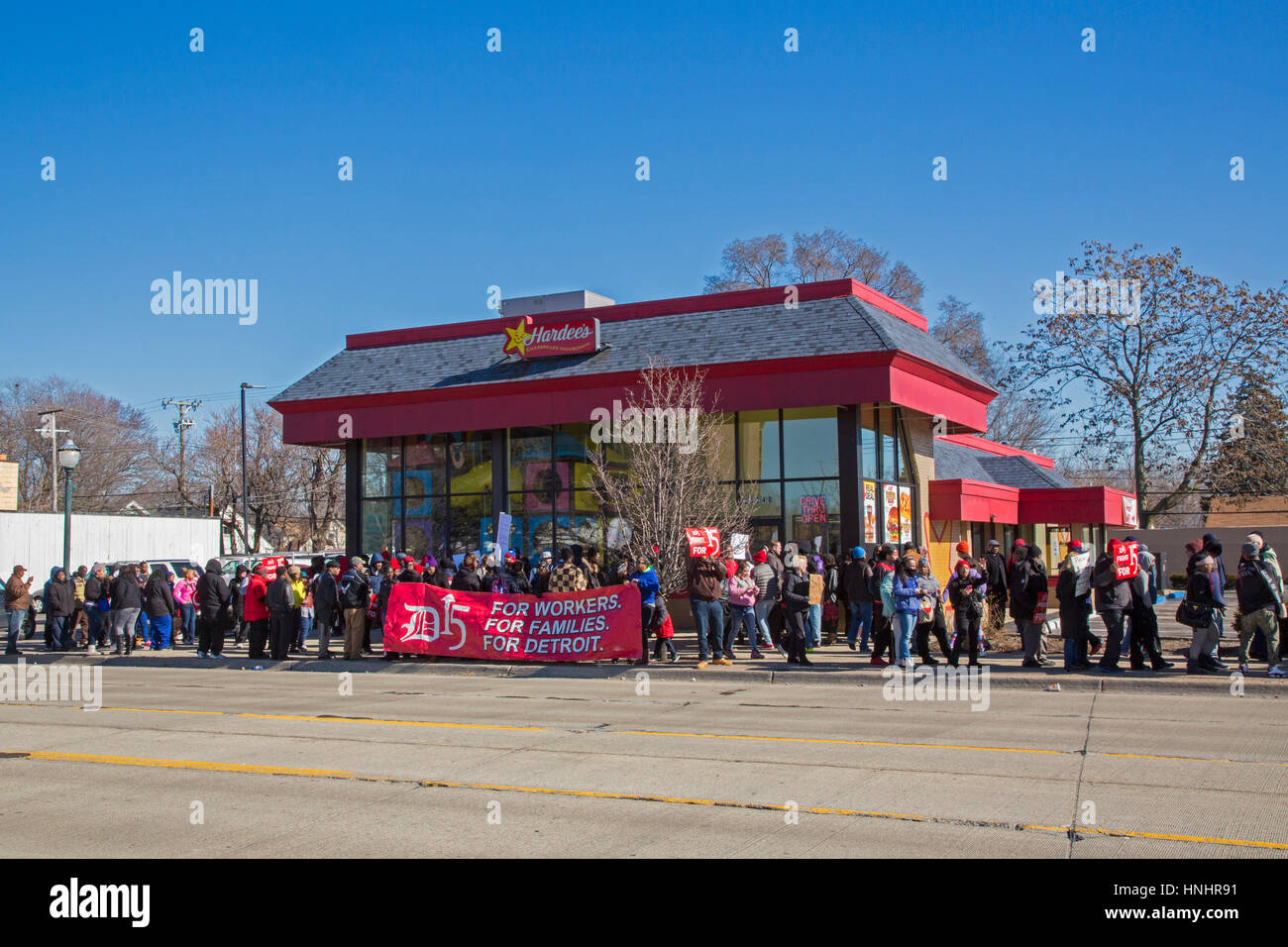 Hazel Park, Michigan, USA. 13th Feb, 2017. Fast food workers and their supporters picket a