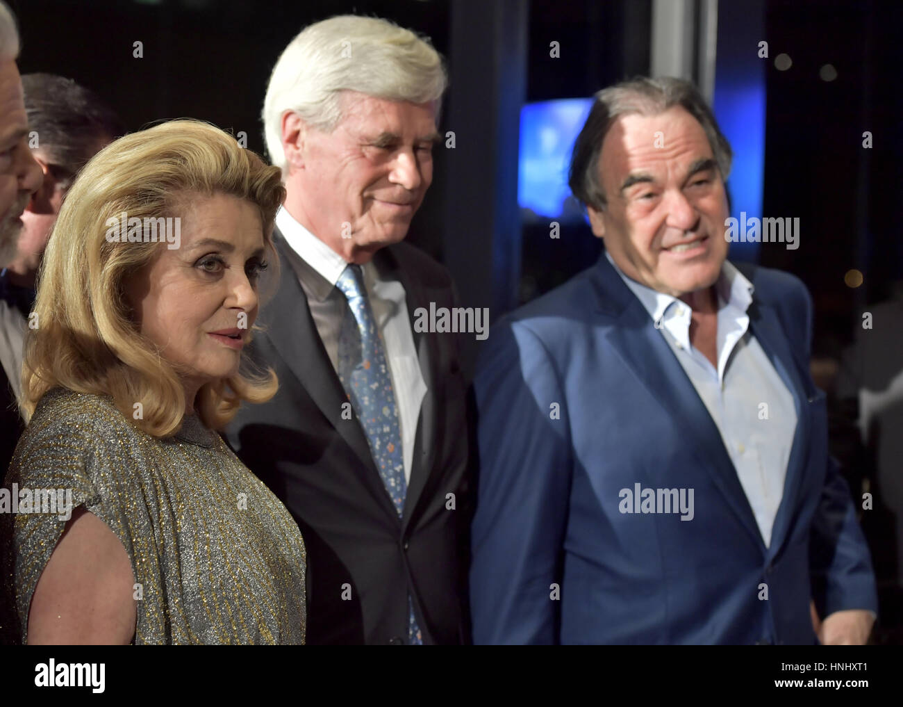 Berlin, Germany. 13th Feb, 2017. The 'Cinema for Peace' Gala in Berlin, Germany, 13 February 2017. French actress Catherine Deneuve (L-R), Hamburg-based entrepreneuer Michael Otto, and US American director Oliver Stone. The awards ceremony and benefit gala is taking place alongside the Berlinale. Photo: John Macdougall/AFP Pool/dpa/Alamy Live News Stock Photo