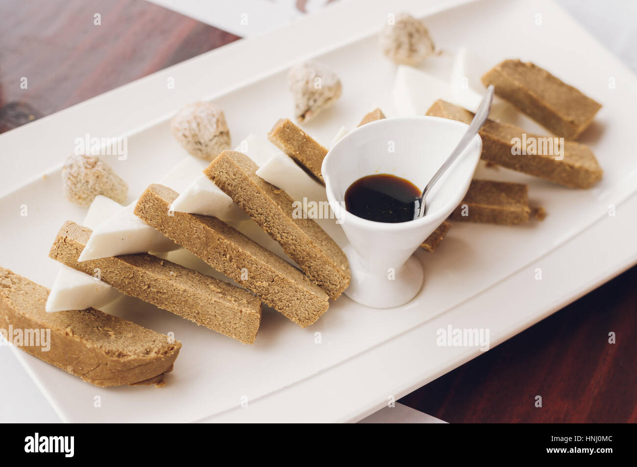 Pella de Gofio with soft cheese and fig, traditional canarian starter meal Stock Photo