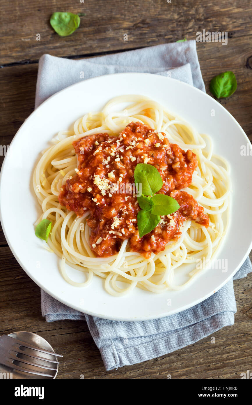 Spaghetti bolognese pasta with tomato sauce and minced meat, grated