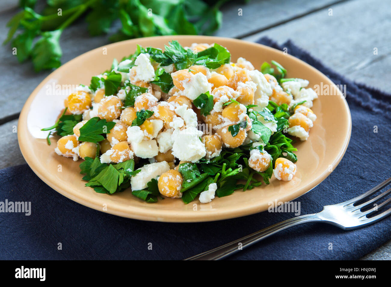 Chickpea salad with fresh feta cheese and parsley healthy organic