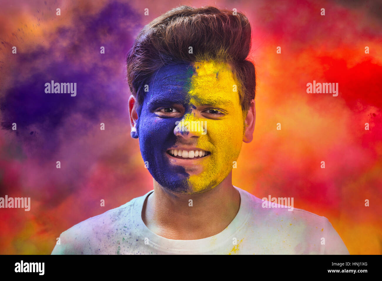 Portrait Of Young Man With Paint On Face During Holi Stock Photo Alamy