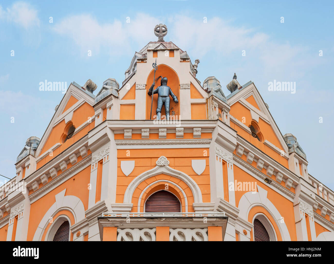 Historic building with dramatic blue cloudy sky Stock Photo - Alamy
