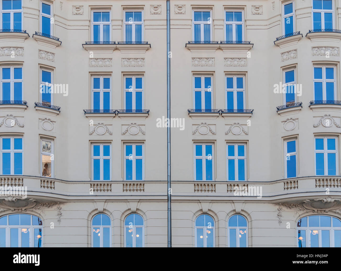 Urban building with blue window in the city Stock Photo - Alamy