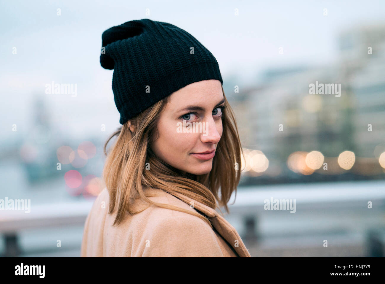 Portrait of woman wearing knit hat Stock Photo