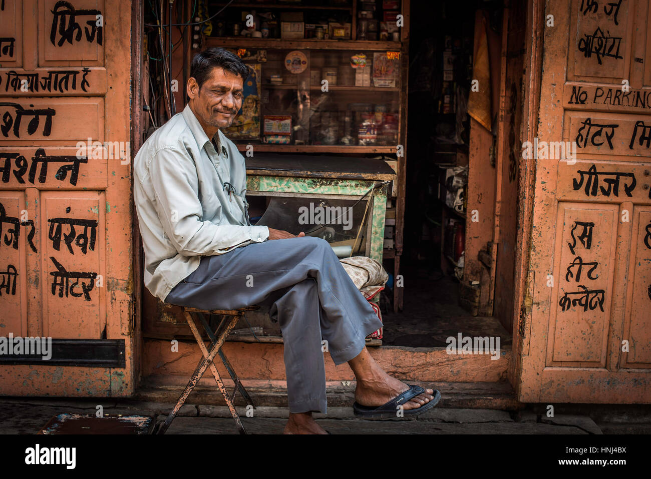 Man sat outside his shop, jaipur, India Stock Photo