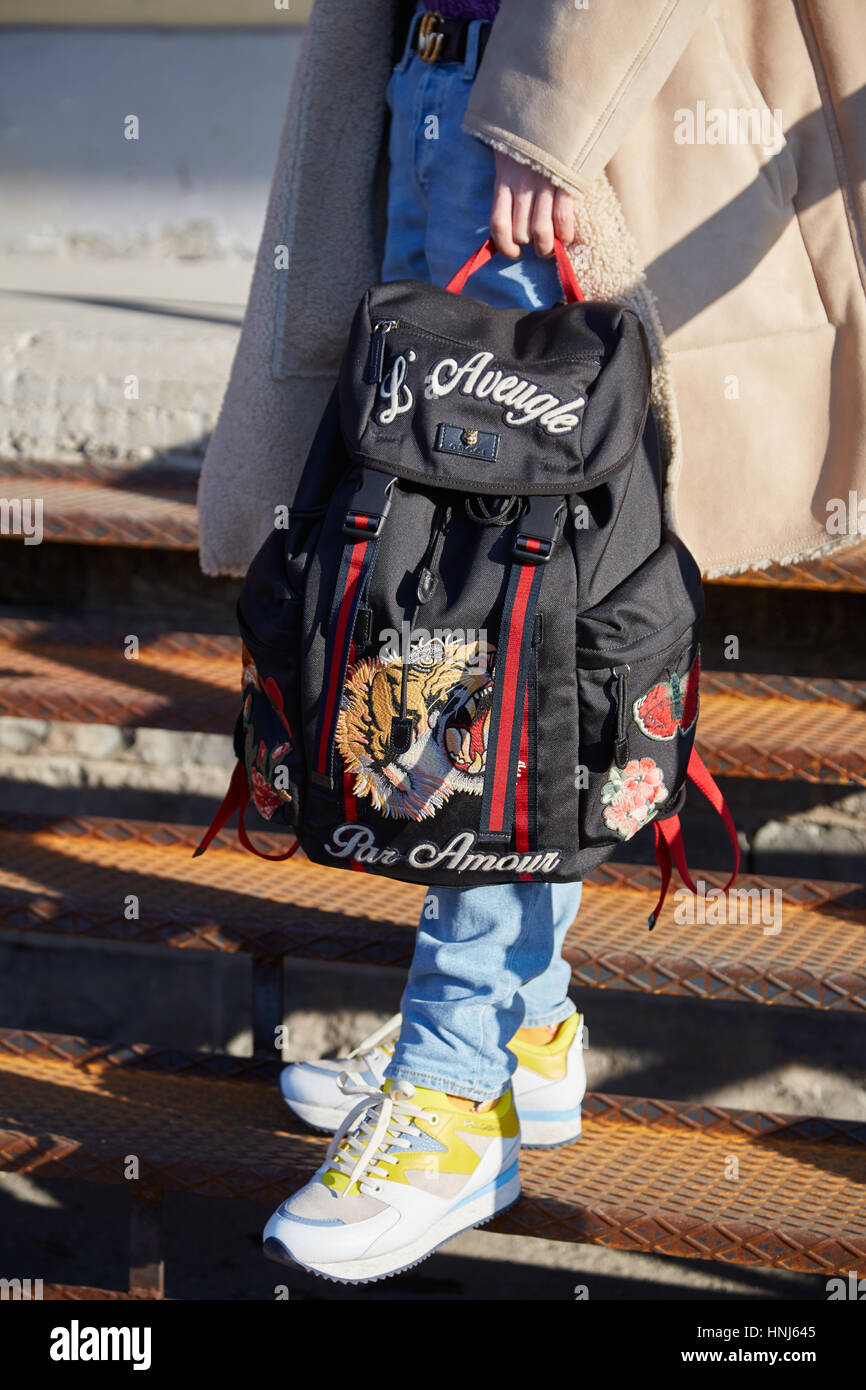 MILAN - JANUARY 15: Man with black and red Gucci backpack with tiger before  Dirk Bikkembergs fashion show, Milan Fashion Week street style on January  Stock Photo - Alamy