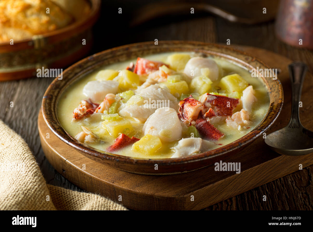 A delicious hot bowl of homemade seafood chowder with lobster, haddock, clams, scallops, and