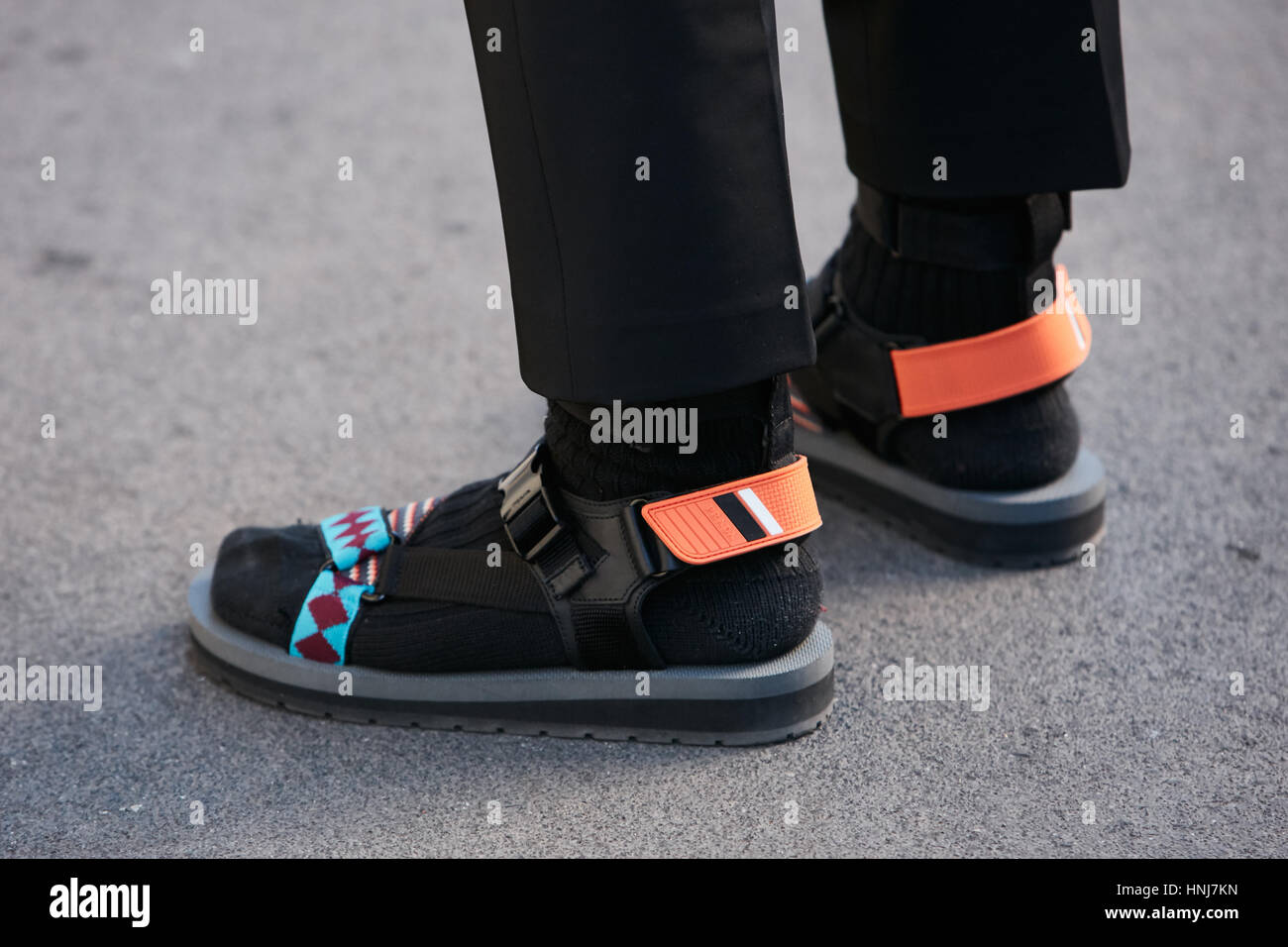 Man with colorful Prada sandals before N 21 fashion show, Milan Fashion Week street style on January 16, 2017 in Milan. Stock Photo