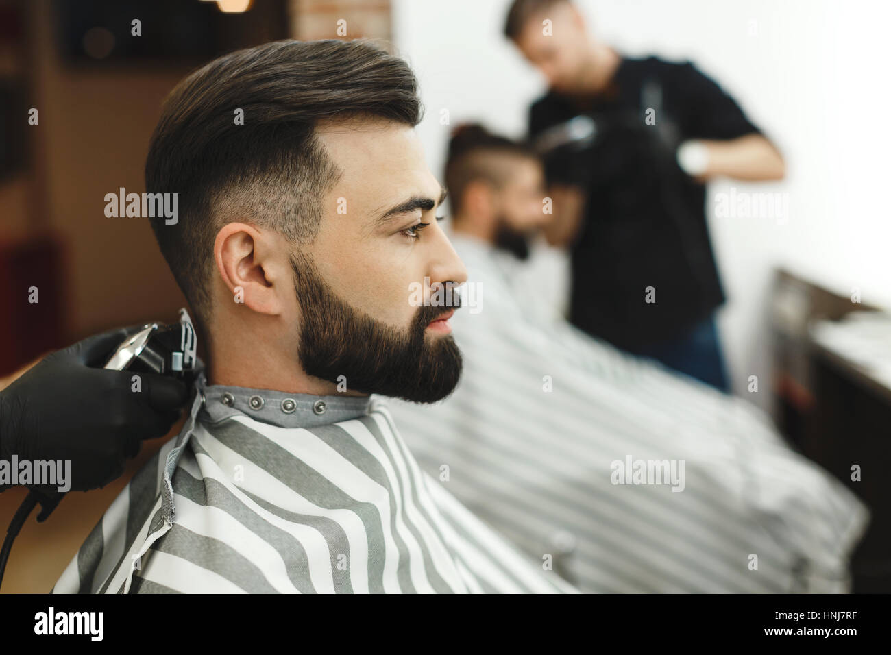 A Barber is Going through the Electric Cutting and Shaving Machine for the  Beard of an African-American Brazilian Boy Stock Image - Image of beauty,  business: 214303807