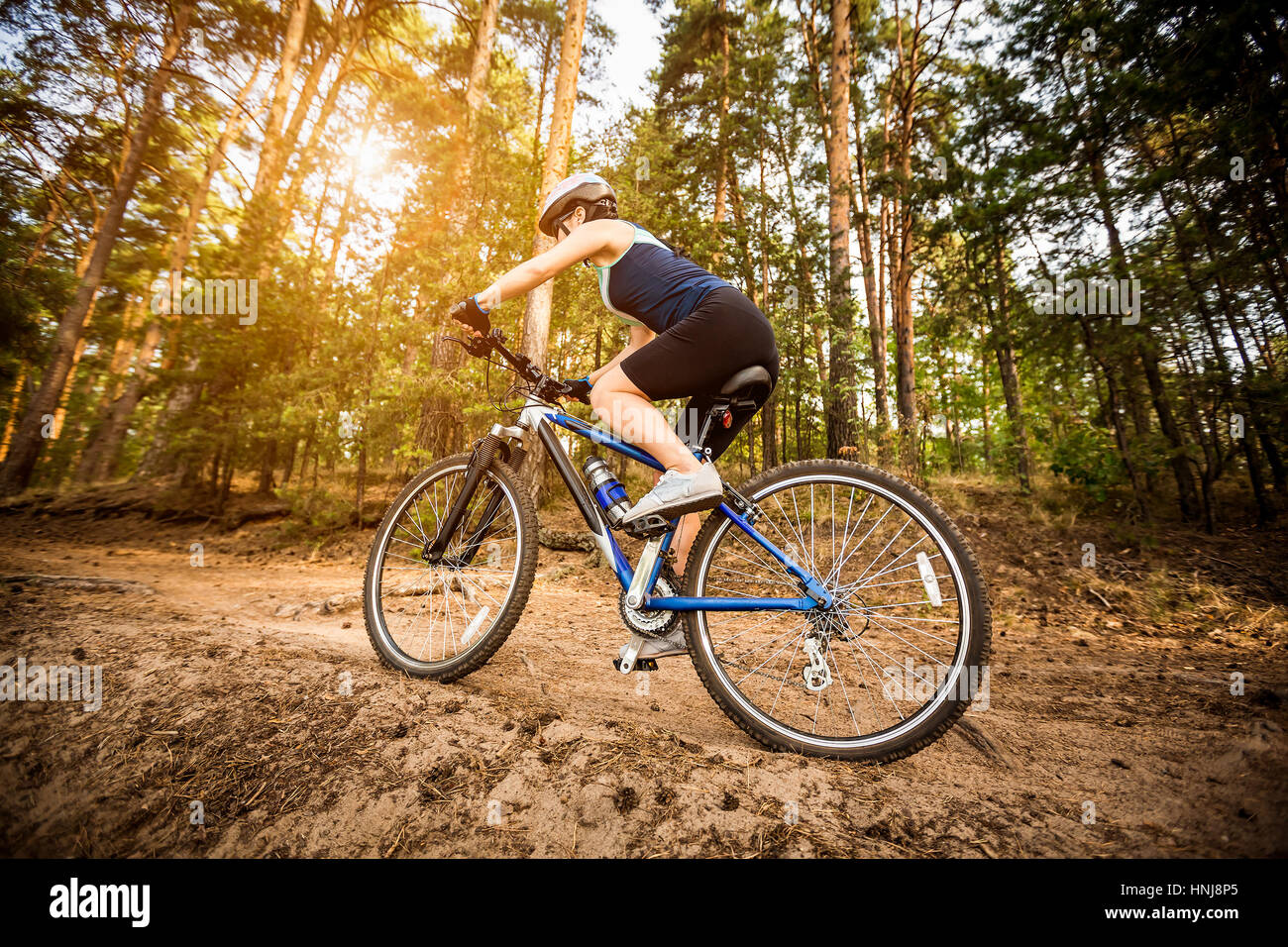 Women on the nature of riding a bike Stock Photo
