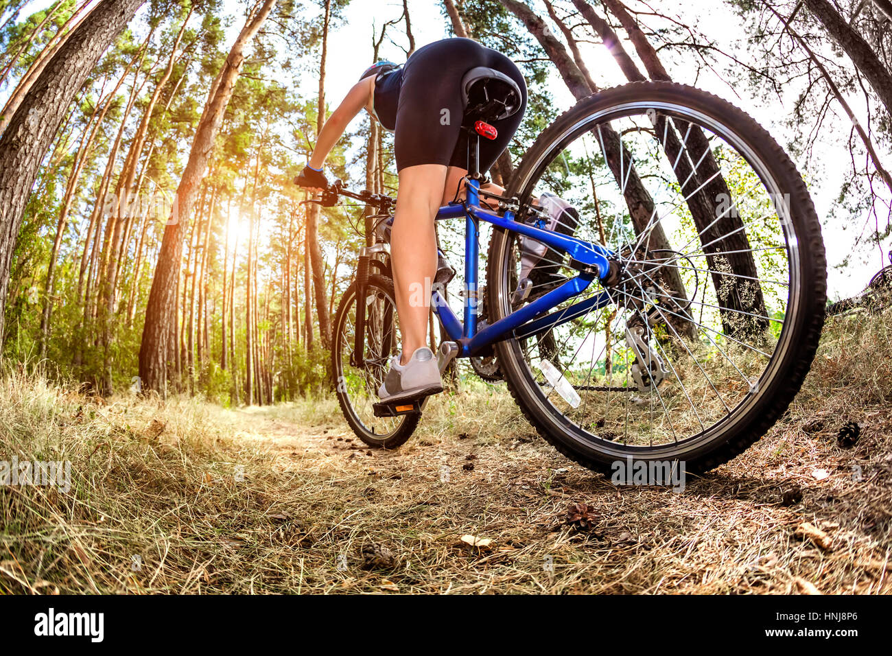 Women on the nature of riding a bike Stock Photo