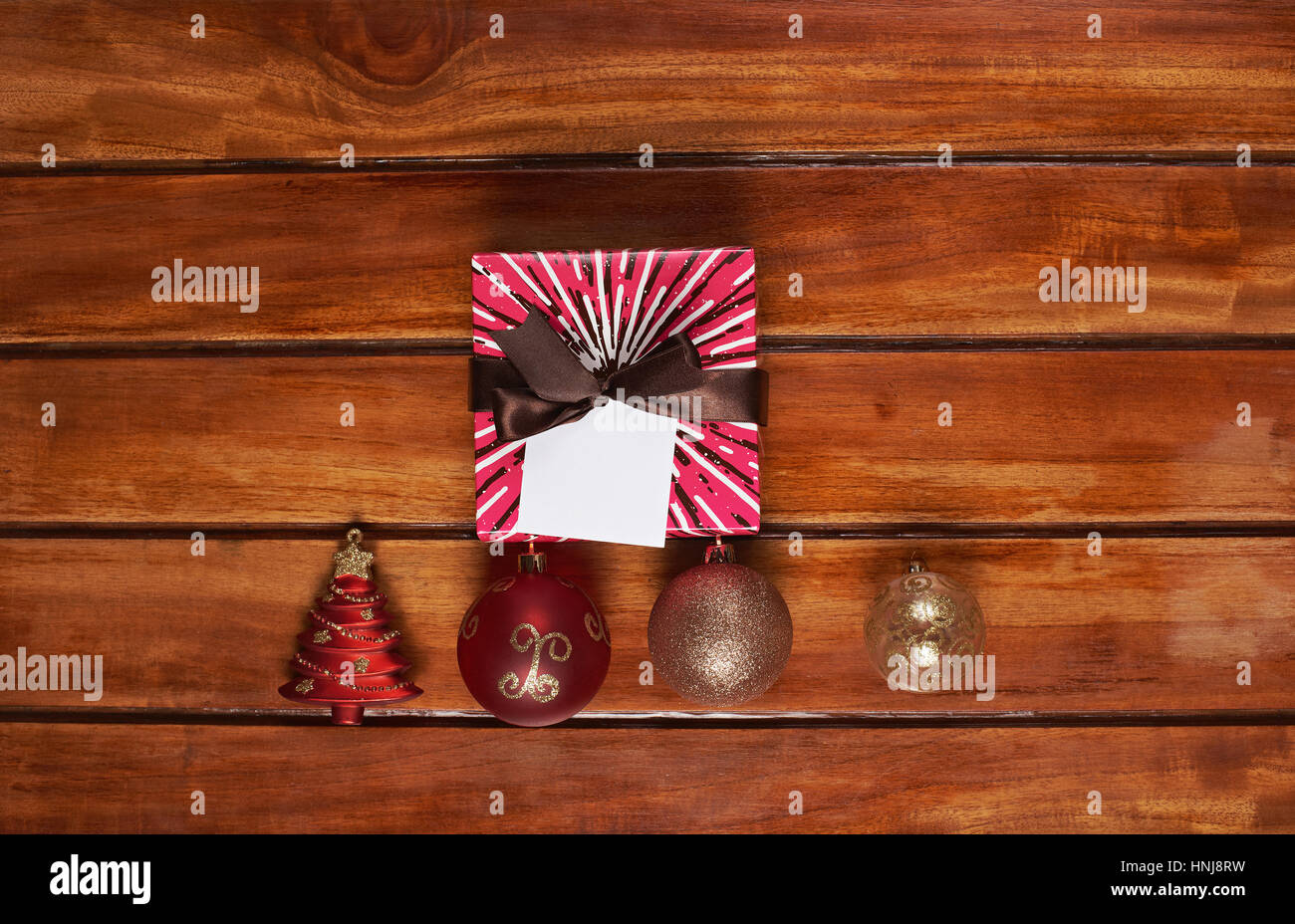 Present colour box on wood table view from top. Christmas decoration on wooden table Stock Photo
