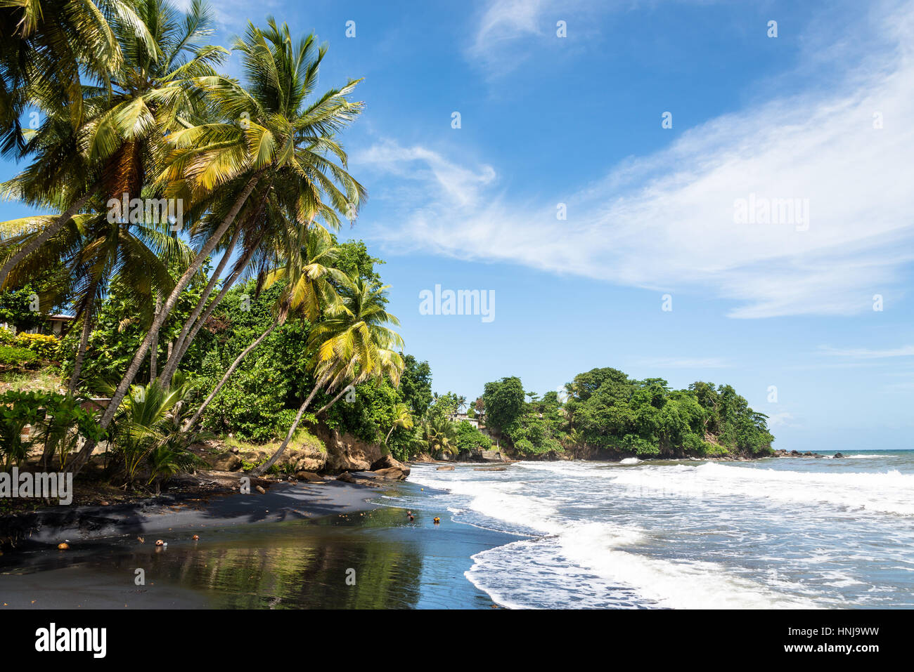 volcanic black sanded beach of Bananier, well known surf spot, Guadeloupe Stock Photo