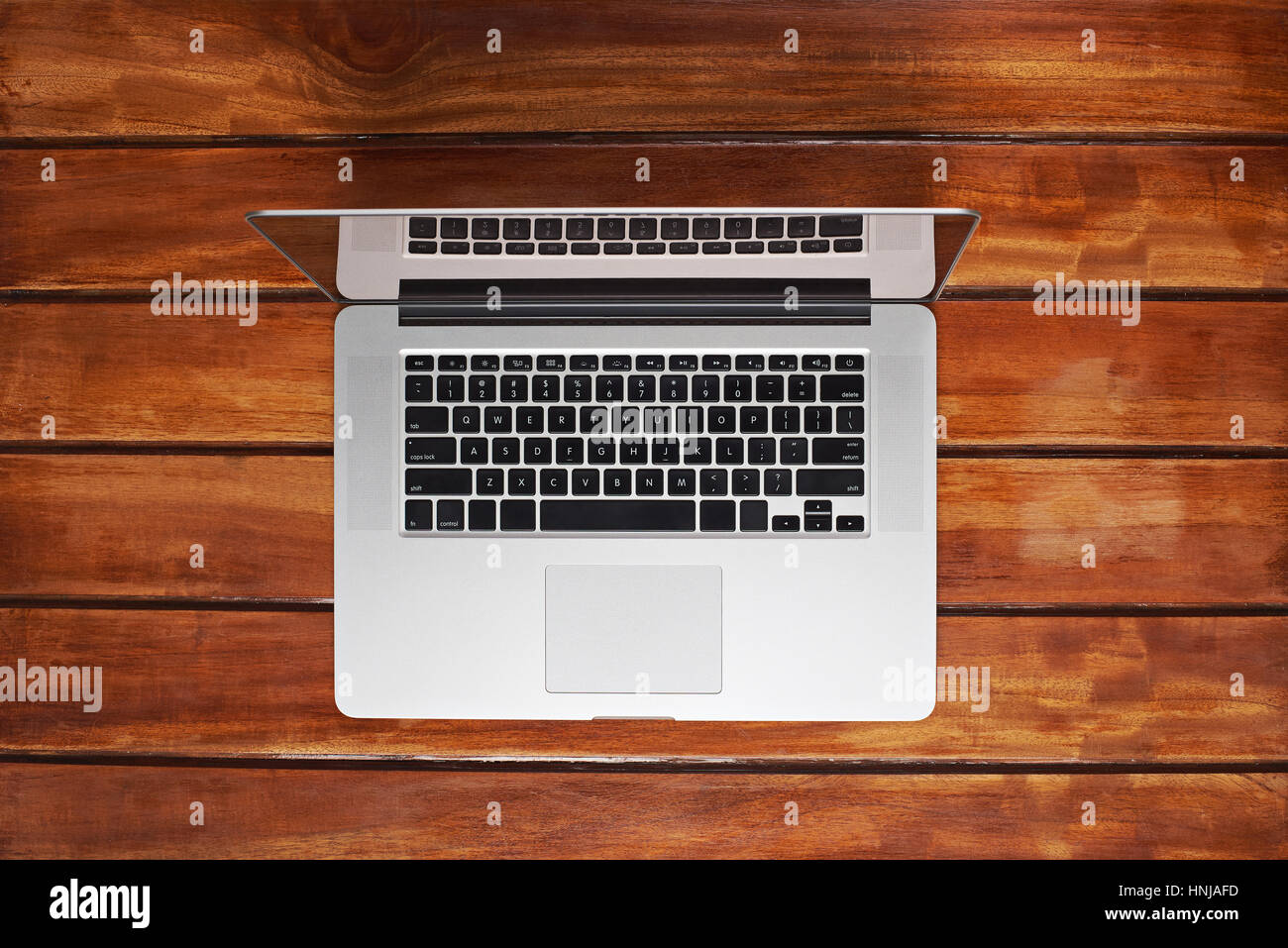 One laptop on wooden table with copy empty space around Stock Photo Alamy